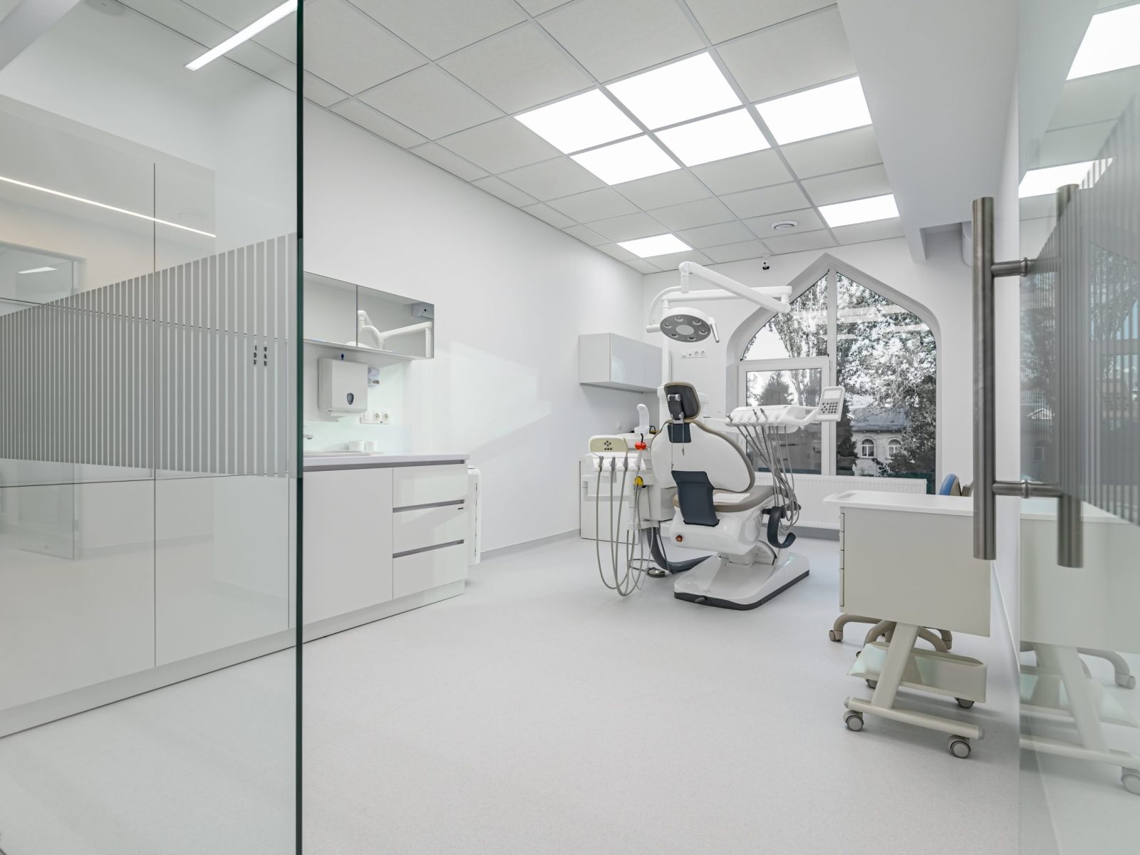 Interior of white modern dentistry medical room with special equipment